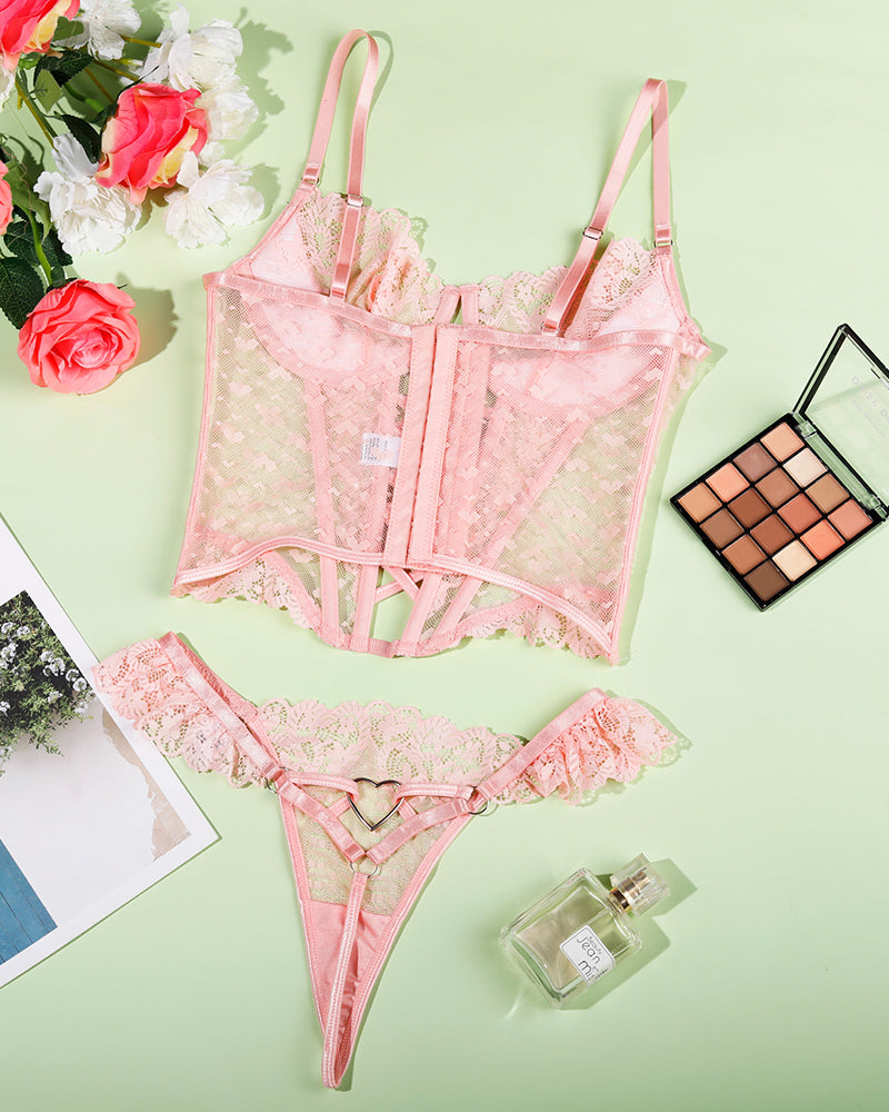 Pink lace heart corset lingerie set with adjustable straps and heart pattern.