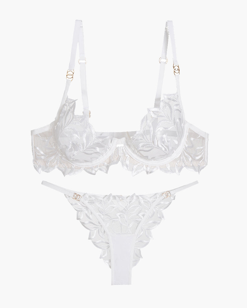 White embroidered lace bra and panty set with floral design, adjustable straps, and see-through