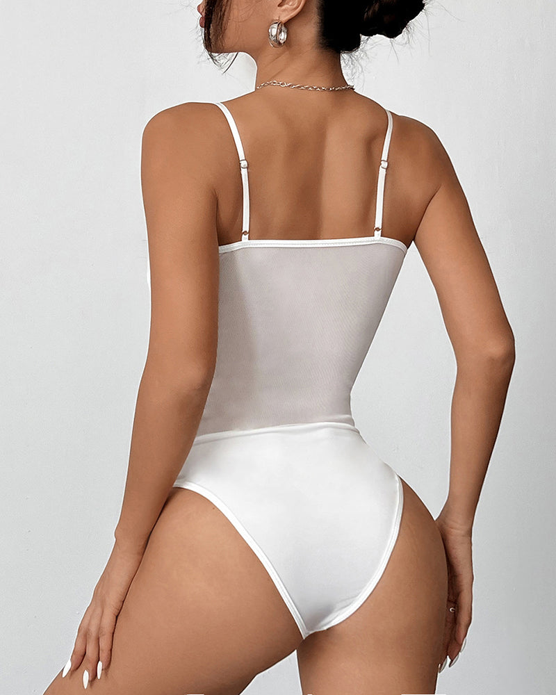 White mesh bodysuit with spaghetti straps and delicate lace trim. Perfect for special events.