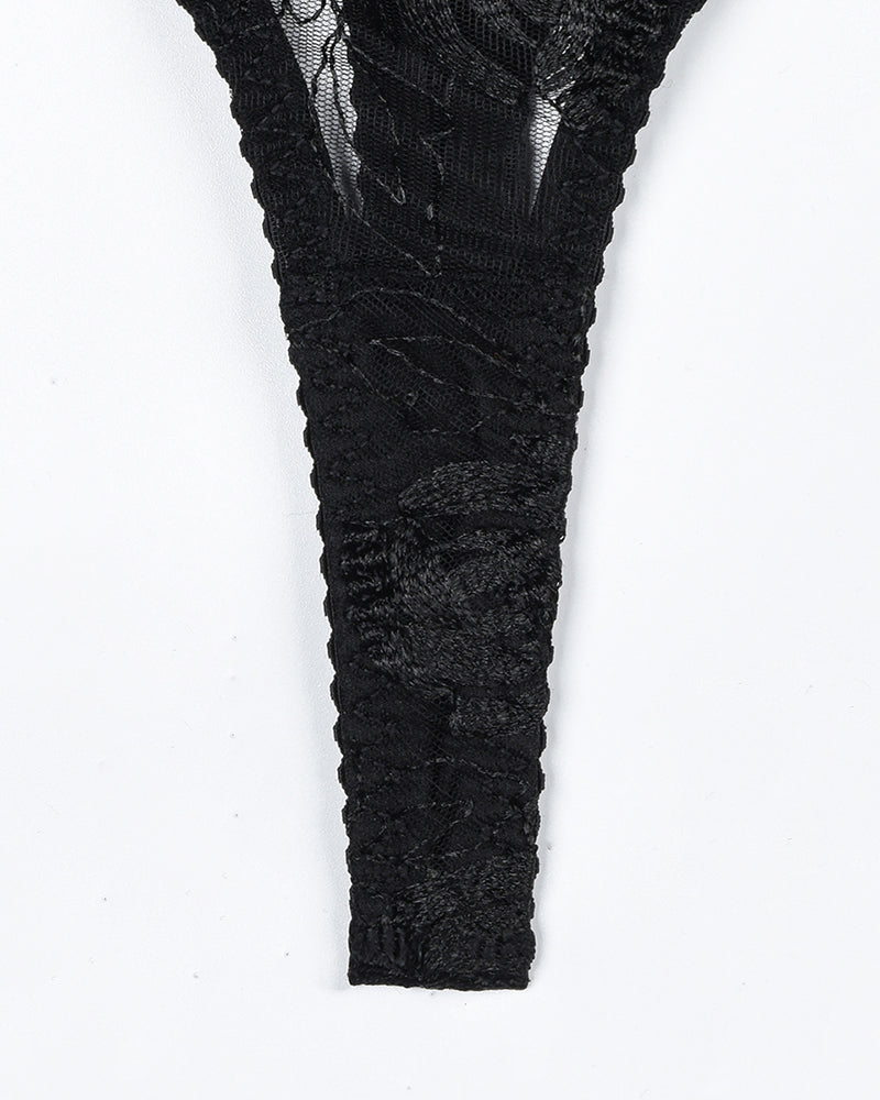 Black vintage lace thong with floral embroidery. Part of a luxurious lingerie set.