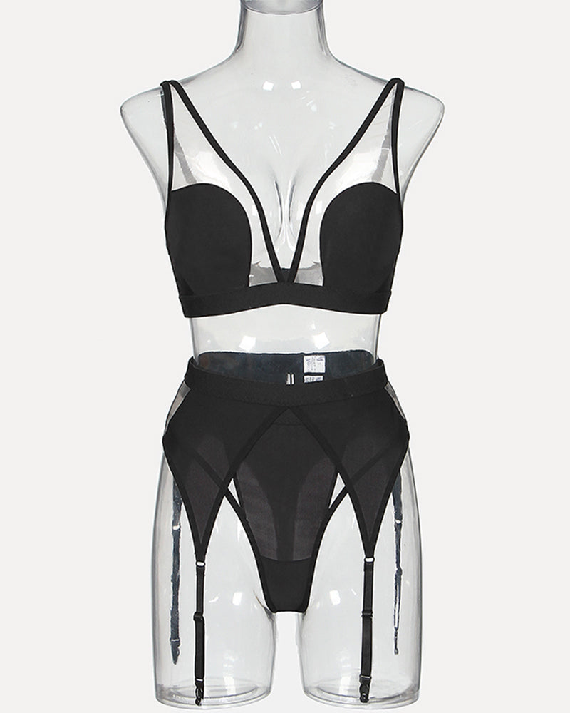 Black mesh lingerie set: elegant bra with straps and garter belt. Comfortable and sexy design.