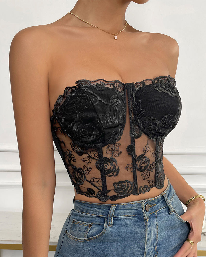 Black floral strapless mesh bustier, boned for support and shaping, perfect for a confident look.