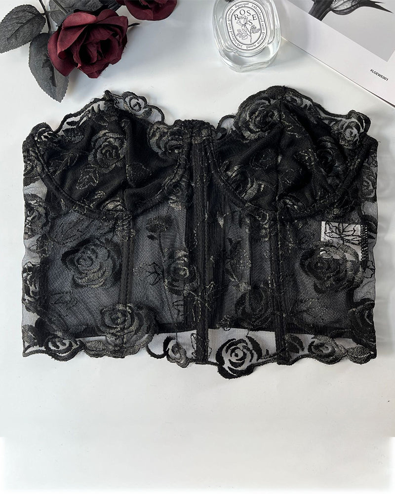 Black floral strapless mesh bustier with boning. Offers elegance and support. Rose embroidery.