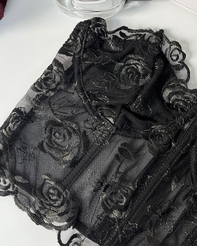 Black floral strapless mesh bustier with rose embroidery and boning for elegant support.