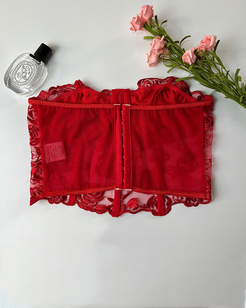 Red strapless mesh bustier with rose embroidery, offering elegant support and waist shaping.