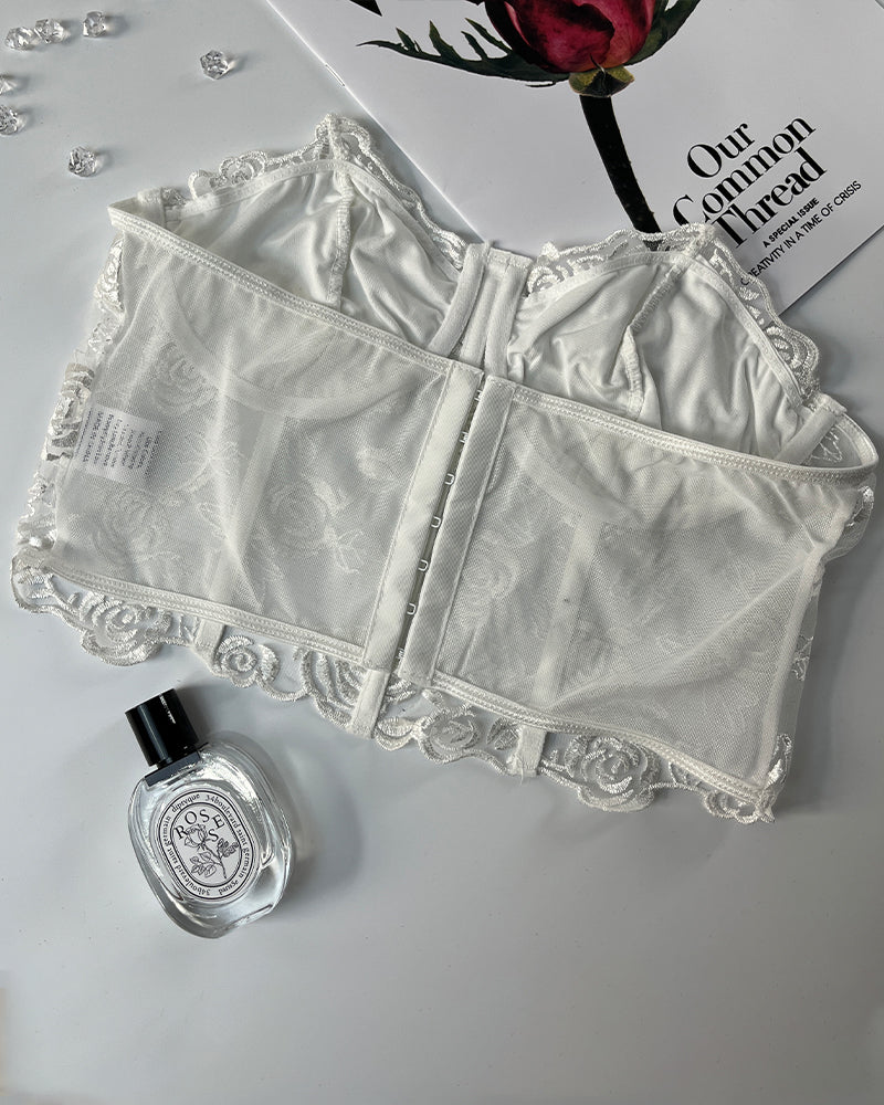 White floral strapless mesh bustier with rose embroidery, waist shaping and bust support.