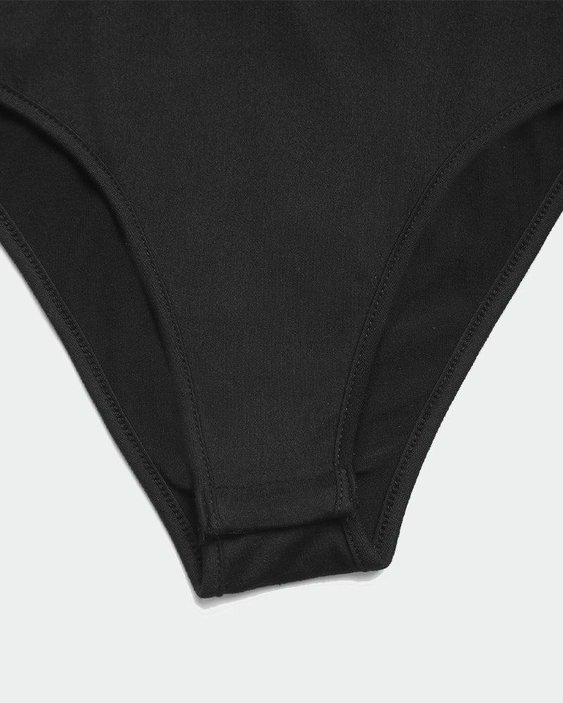 Black bodysuit bottom detail. Smooth fabric, comfortable fit. Shows stitching and design.