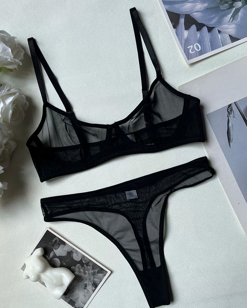 Black sheer mesh lingerie set: push-up bra and high-waisted thong for a bold look.