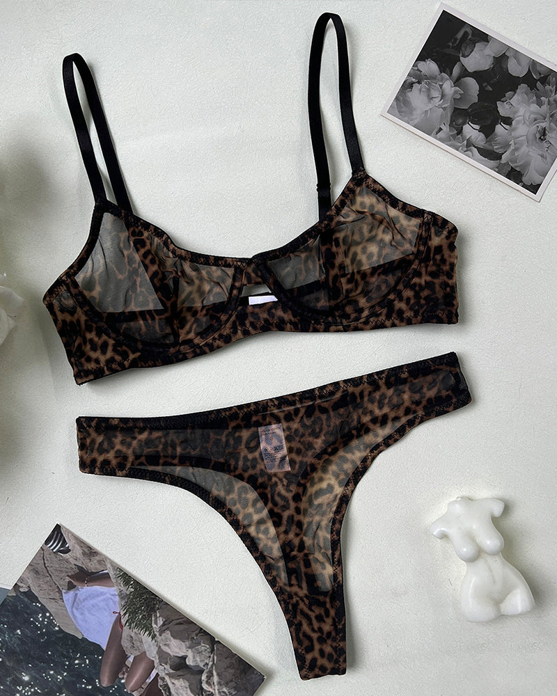 Leopard print sheer lingerie set with push-up bra and high-waisted thong, bold leopard pattern.