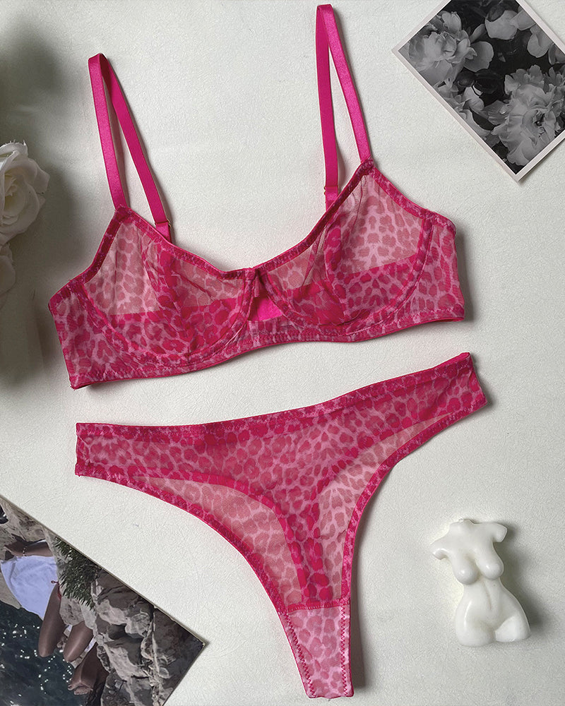 Pink leopard print lingerie set with sheer bra and high-waisted thong for a bold look.