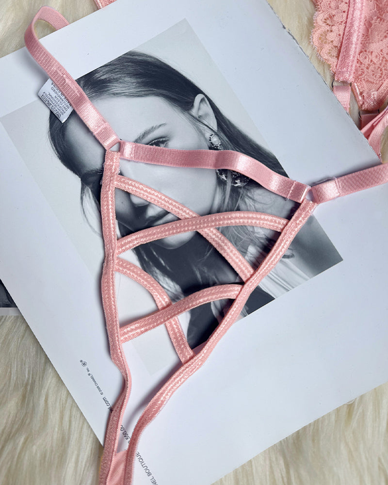 Pink strappy thong from floral lace lingerie set. Crisscross design for a confident look.