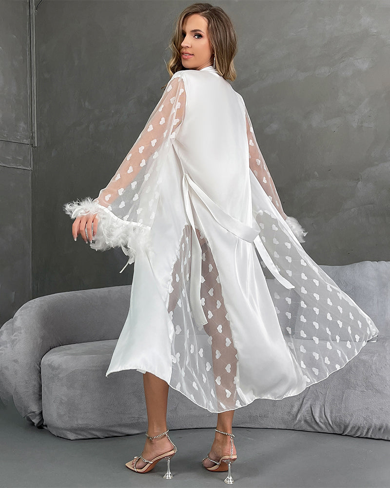 White satin nightgown with heart sleeves and feather trim, perfect for a sensual look