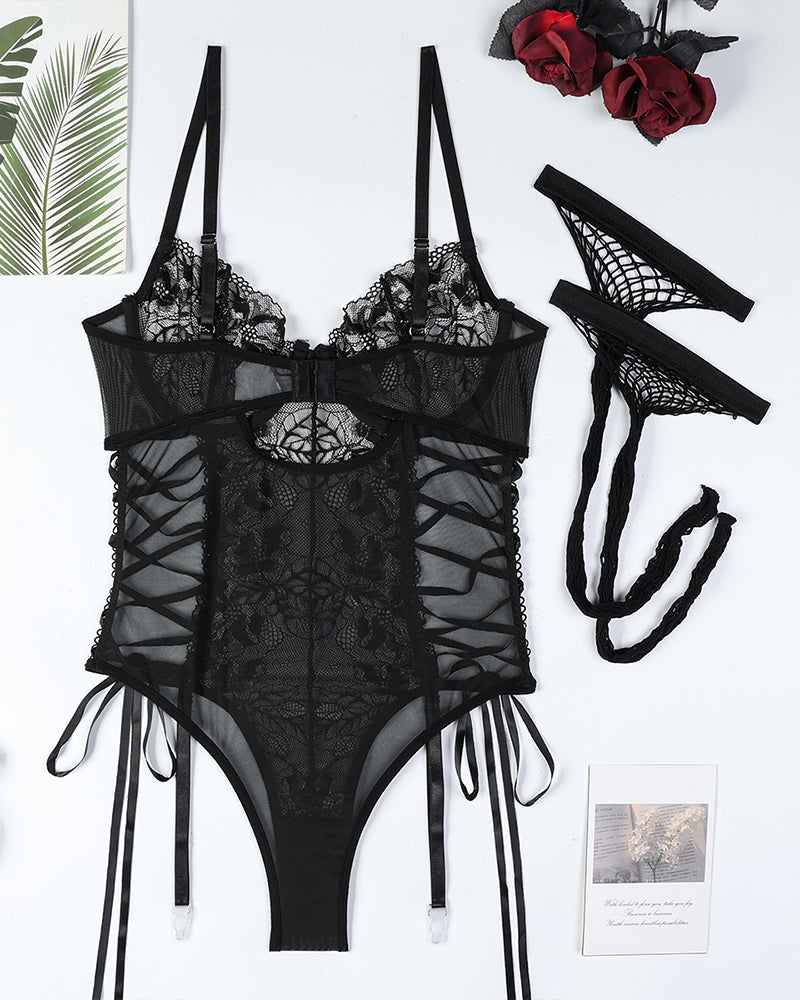 Black lace bodysuit with criss-cross detail and stockings. Sexy lingerie set.