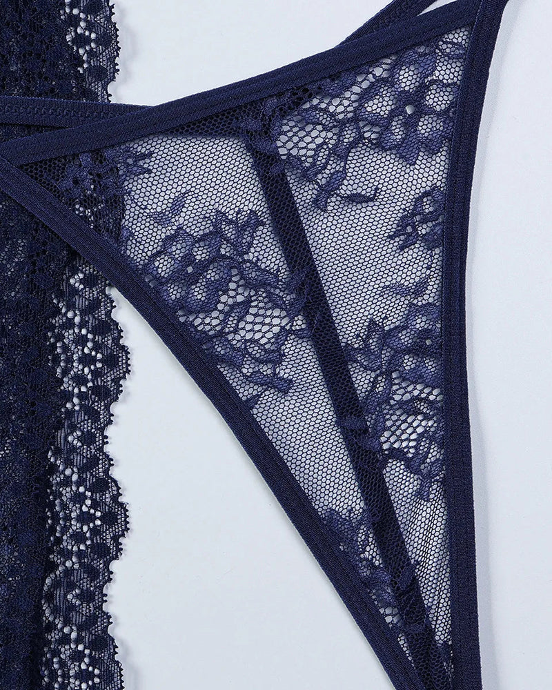 Navy blue lace lingerie detail. Romantic nightwear with floral patterns and mesh see-through.