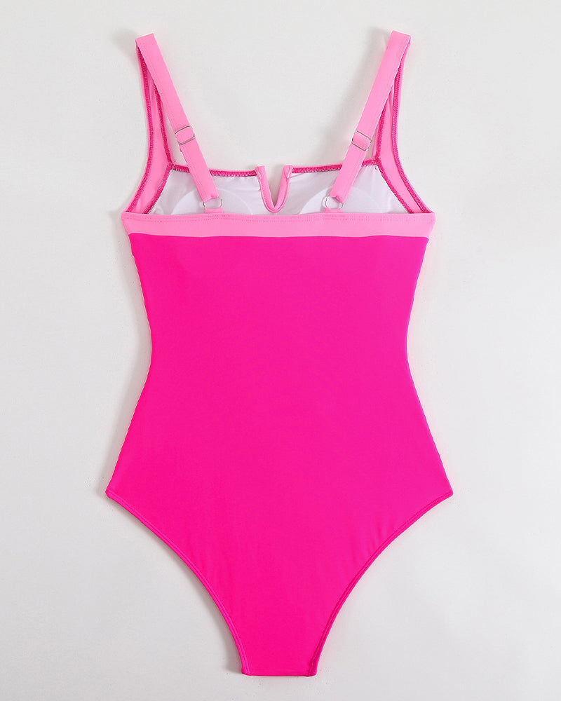 Pink push-up padded one-piece swimsuit with adjustable straps, hugging curves, perfect fit