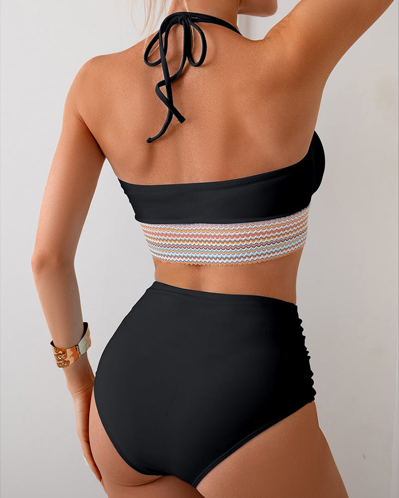 Black color block bikini set with halter top and high-waisted bottoms, retro swimwear