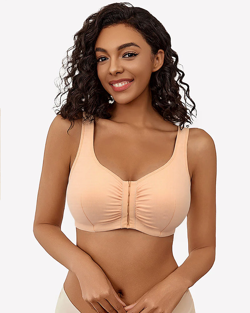 Beige front clasp non-wired bra. Full cup, thin mold cup, fixed straps. Woman smiling.