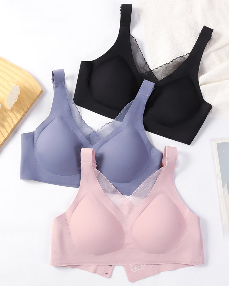 Seamless push-up bras in black, periwinkle, and pink with fixed straps and traceless design.