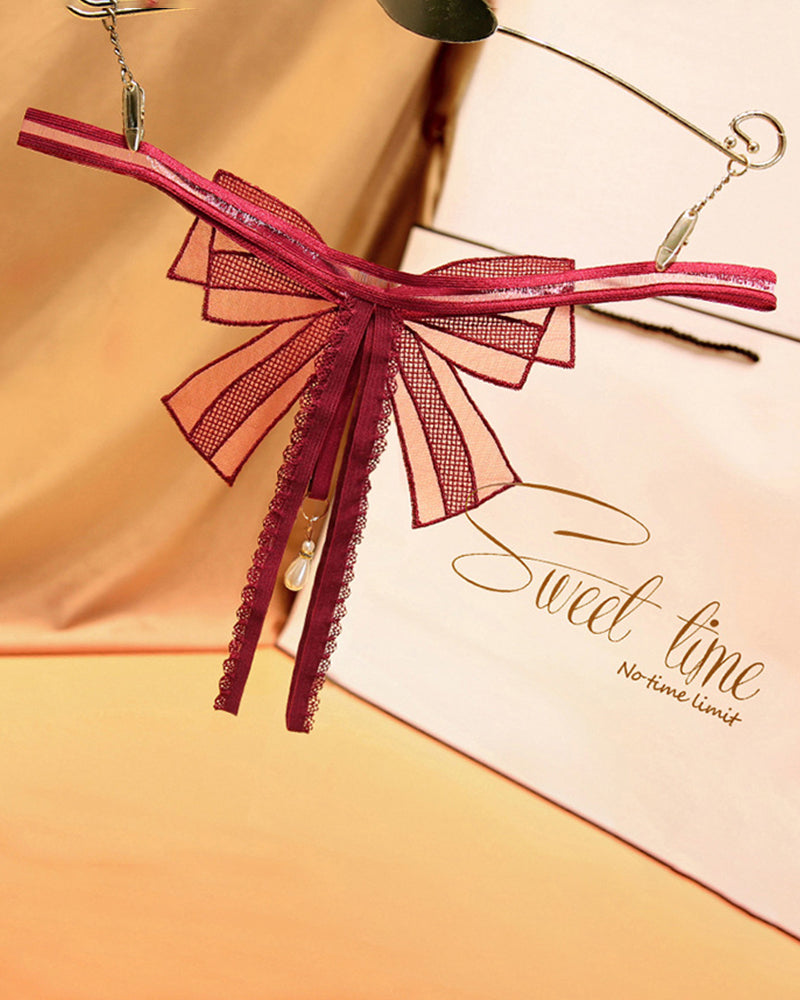 Burgundy lace bowknot crotchless thong with pearl pendant. Sweet time, no time limit.