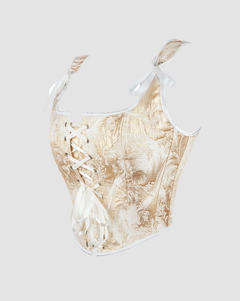 Golden 1950s corset with floral pattern, white straps, and lace-up front