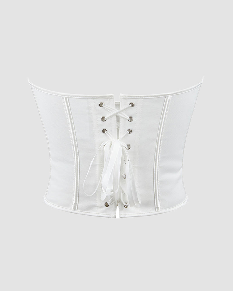 White boned corset with lace-up back for waist and abdomen support, ideal for parties