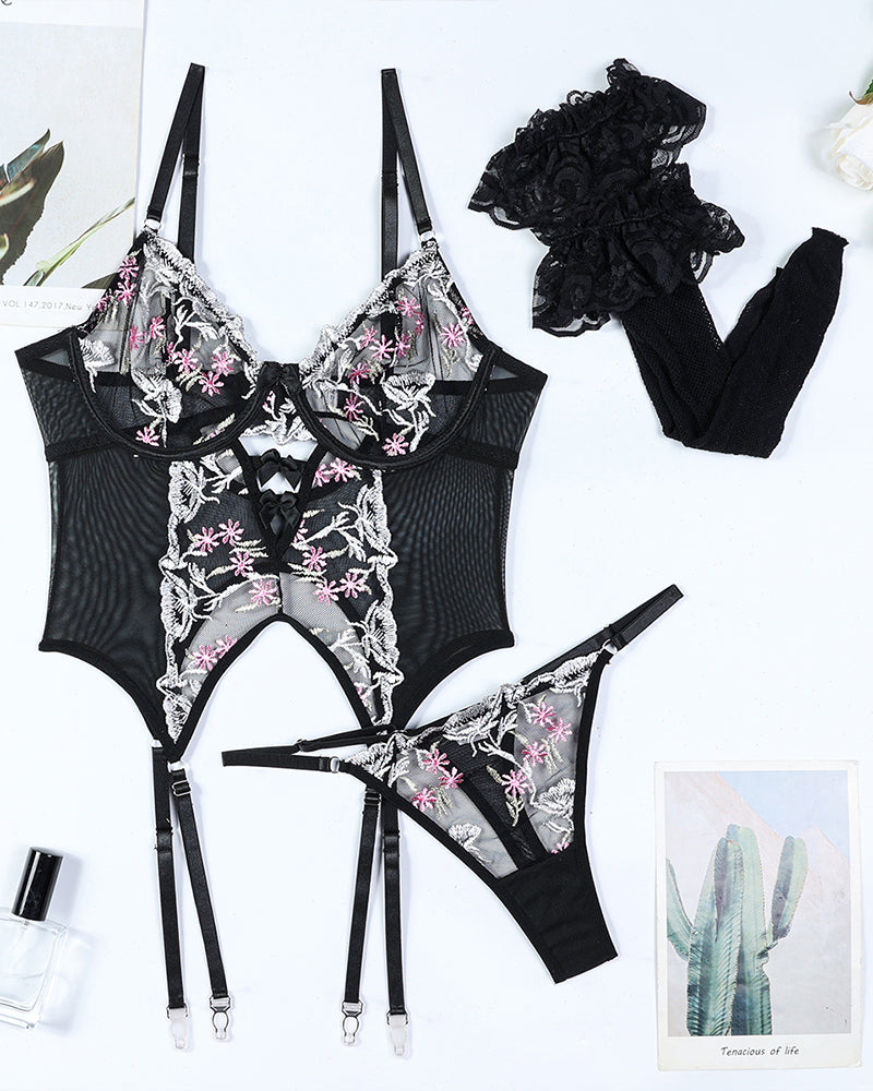 Black floral embroidered lingerie set with stockings. Sexy sheer design for women, polyester.
