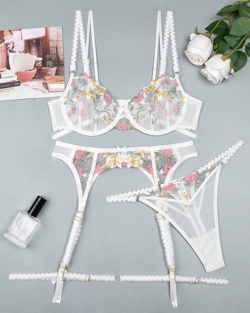 Embroidered white lingerie set with floral details. Sexy bra, garter belt, and thong for women.