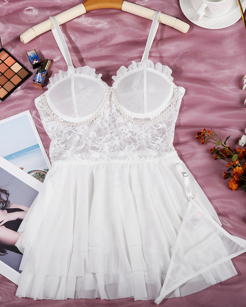 White lace suspender nightdress with layered skirt and lace detail. Sexy lingerie for women.