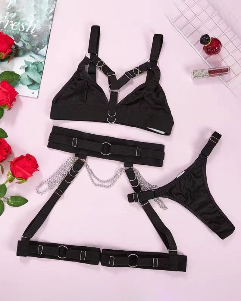 Black metal chain strap bra set. Sexy lingerie with harness and chain details. Polyester fabric.