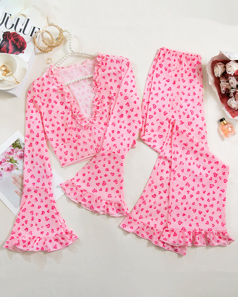 Long-sleeved pink heart print pajama set with ruffled top and pants for women
