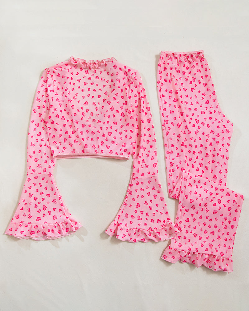 Pink heart print pajama set with ruffled top and bell sleeves, comfortable sleepwear for women