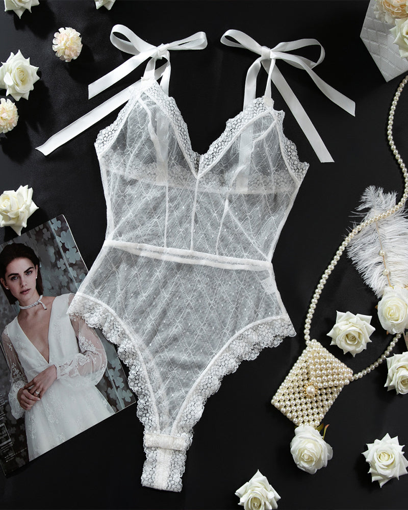 White sheer lace bodysuit with ribbon straps, perfect for special nights. Sexy lingerie for women.