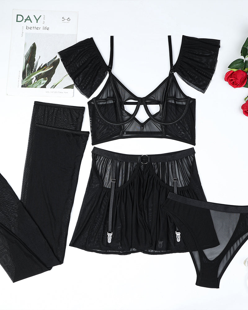 Black heart cut out lingerie set with mesh bralette, garter skirt, and stockings. Sexy lingerie.