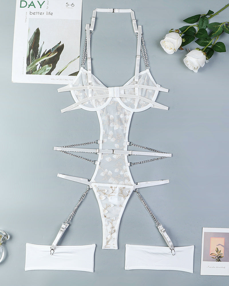 Lace embroidered chain bodysuit in white, featuring adjustable straps and floral details.