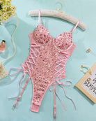 Pink sequin mesh erotic butterfly bodysuit with lace-up details, adjustable straps.