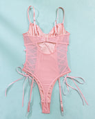 Pink mesh erotic bodysuit with adjustable straps and lace-up details, highlighting feminine charm.