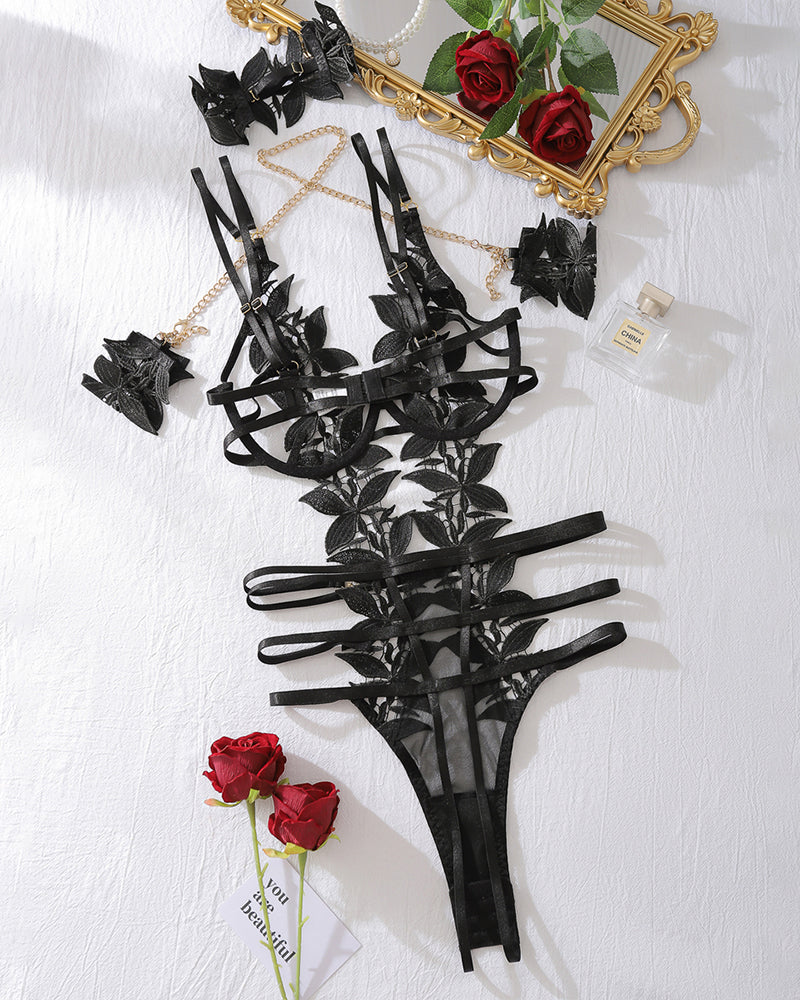 Black floral embroidery bodysuit with chain bracelet. Sexy halter neck lingerie for romantic nights.