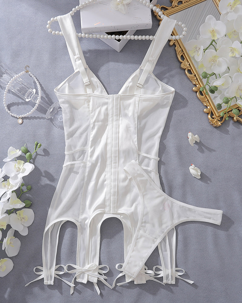 White satin mini dress with open cups, garter straps, and bow details, perfect for a special night