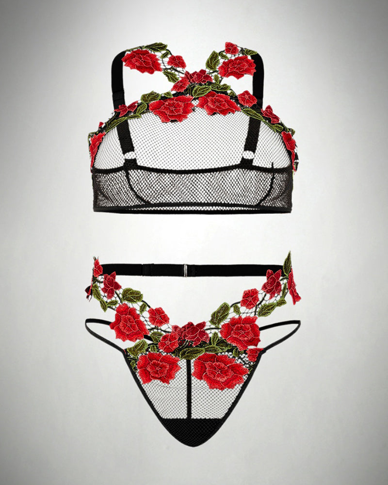 Black fishnet lingerie set with red rose embroidery. Plus size lingerie with floral details.