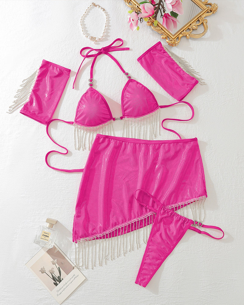Pink halterneck tassel lingerie set. Bold design with bra, mini skirt, arm cuffs, and thong.