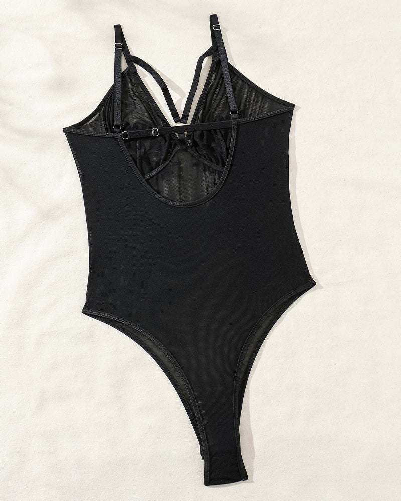 Black mesh bodysuit with spaghetti straps and curve-enhancing design, perfect for layering.