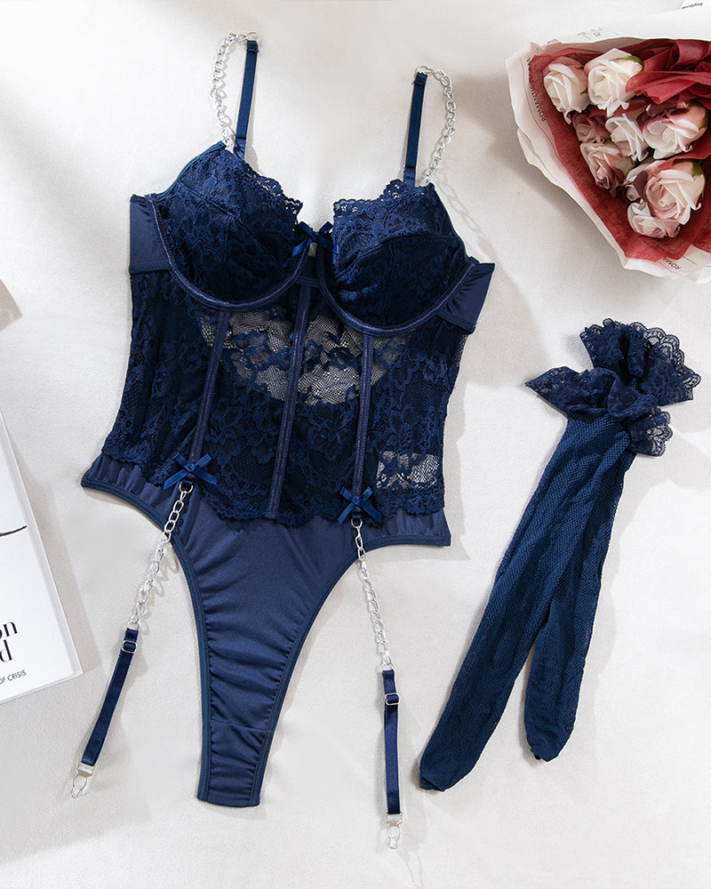 Navy lace bodysuit with chain straps and stockings, a sexy lingerie set.