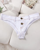 Denim thong low-rise panties in light blue, flat lay with two gold snaps
