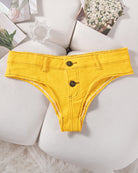 Denim thong low-rise panties in yellow, flat lay with two gold snaps