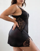 Black satin chemise slip dress with lace appliqué and deep V cups, sleeveless