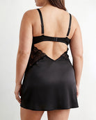 Black satin chemise slip dress with lace back cutout and adjustable shoulder straps