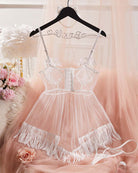 White sheer mesh babydoll lingerie on hanger with fringe skirt and tie straps