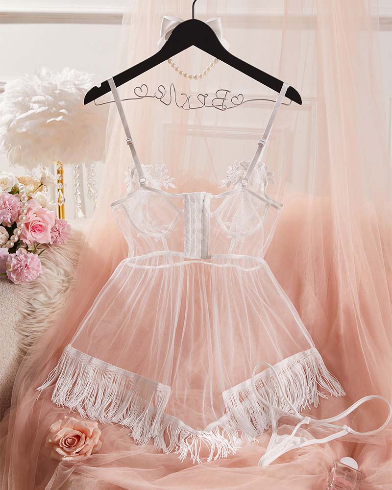 White sheer mesh babydoll lingerie on hanger with fringe skirt and tie straps