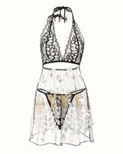 Lace-trim babydoll lingerie with black halter top and sheer skirt with golden motifs