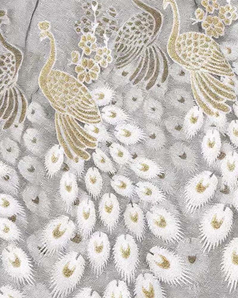 Embroidered sheer babydoll fabric panel with white and gold peacock feather motifs